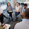 Conference-attendees-sitting-in-a-circle-at-a-breakout-session